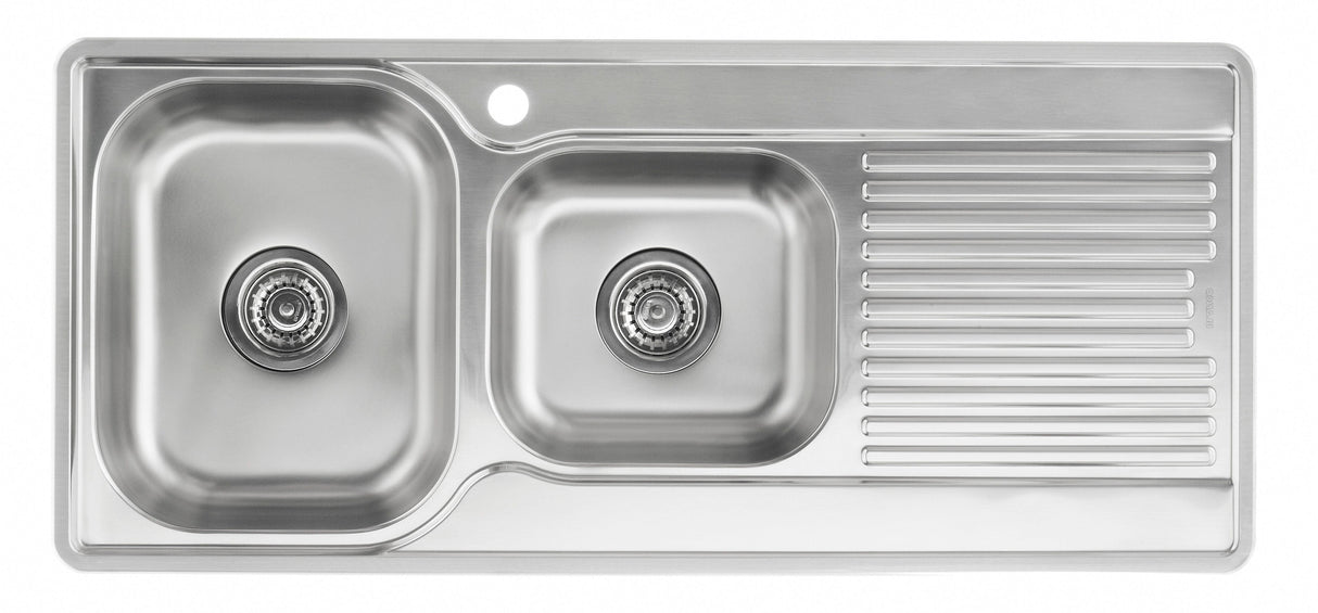 Stainless steel kitchen sink with a drainboard on a white background