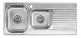 Stainless steel kitchen sink with a drainboard on a white background