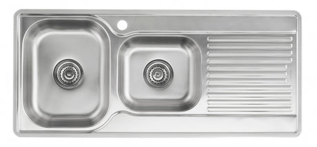 Stainless steel kitchen sink with a drainboard on a white background