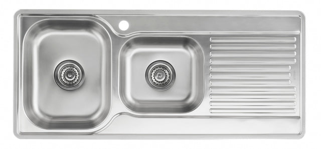 Stainless steel kitchen sink with a drainboard on a white background